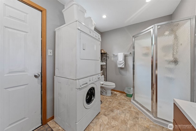 112 Mountain View Dr N, Ashford, WA 98304 - clothes washing area with recessed lighting, laundry area, baseboards, and stacked washer and clothes dryer