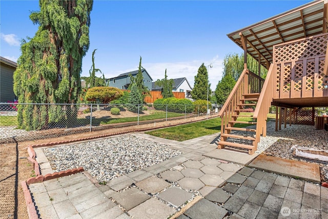 view of patio / terrace featuring stairway, a fenced backyard, and a deck