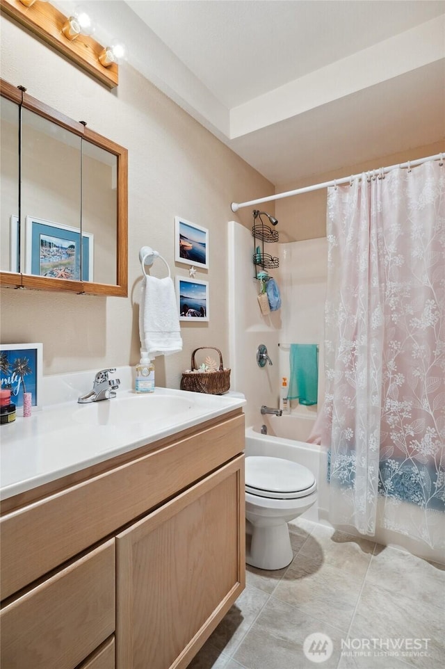 full bathroom with toilet, tile patterned floors, shower / bath combo with shower curtain, and vanity