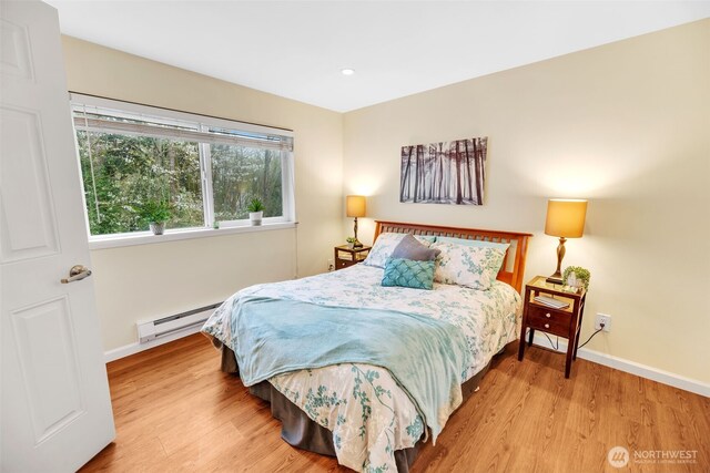 975 Aberdeen Ave NE Unit F207, Renton, WA 98056 - bedroom featuring recessed lighting, a baseboard heating unit, baseboards, and wood finished floors