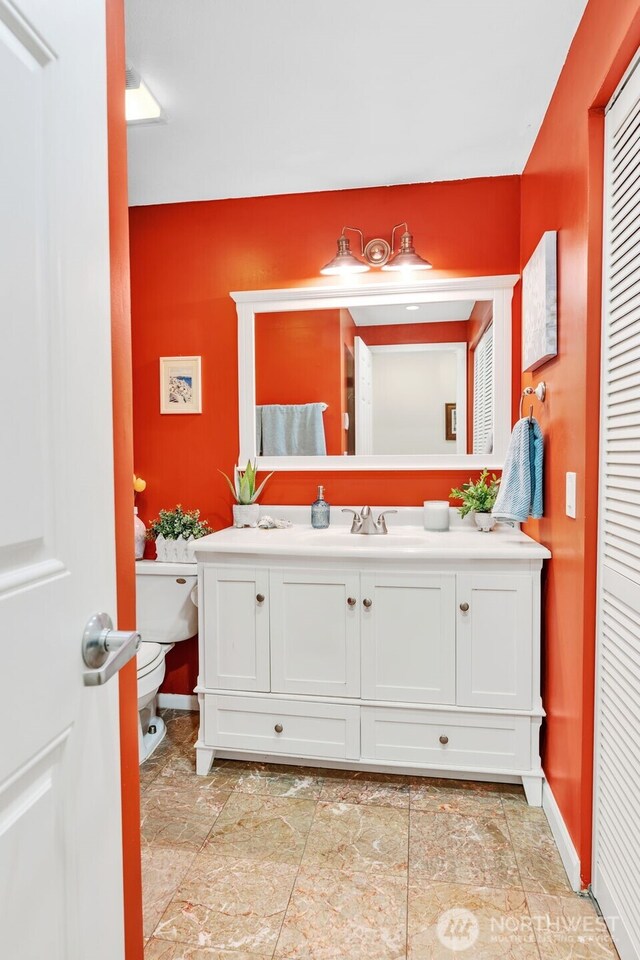 975 Aberdeen Ave NE Unit F207, Renton, WA 98056 - bathroom featuring vanity, baseboards, and toilet