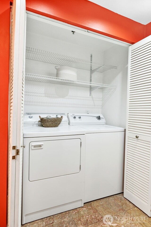 975 Aberdeen Ave NE Unit F207, Renton, WA 98056 - laundry area with stone finish flooring, independent washer and dryer, and laundry area