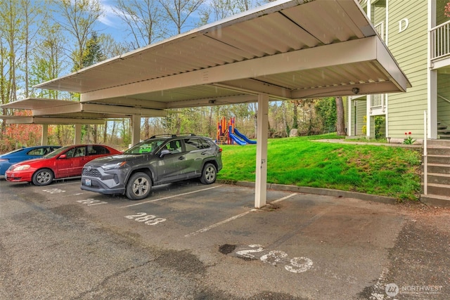 975 Aberdeen Ave NE Unit F207, Renton, WA 98056 - covered parking lot featuring a playground