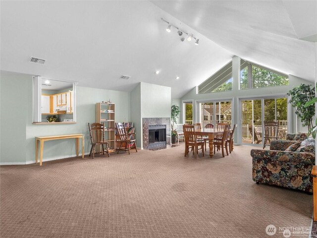 975 Aberdeen Ave NE Unit F207, Renton, WA 98056 - living room with visible vents, baseboards, a multi sided fireplace, and carpet floors