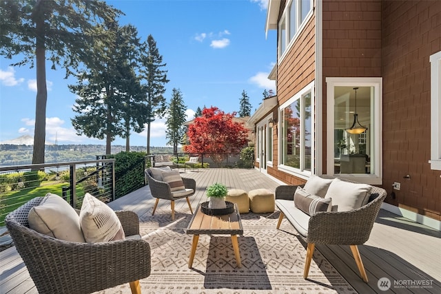 exterior space featuring an outdoor living space and a deck