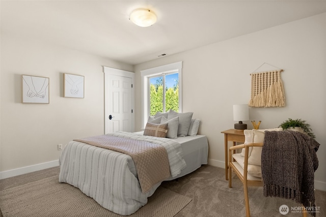 carpeted bedroom with baseboards and visible vents