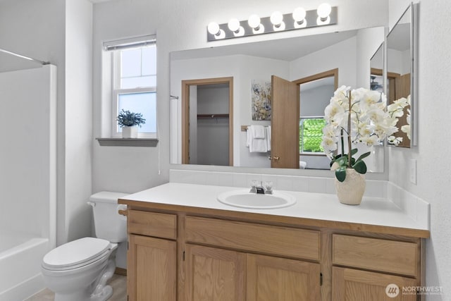 full bathroom featuring toilet and vanity