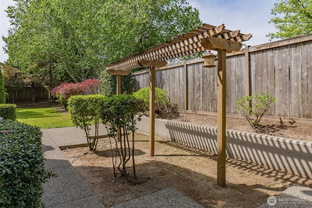 view of patio with fence and a pergola