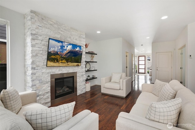 living area with a fireplace, recessed lighting, and wood finished floors