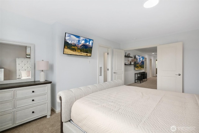 bedroom featuring light carpet