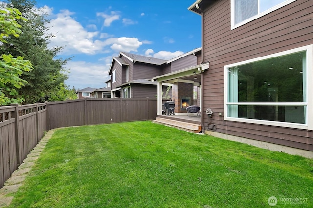 view of yard with a fenced backyard