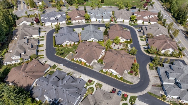 birds eye view of property with a residential view