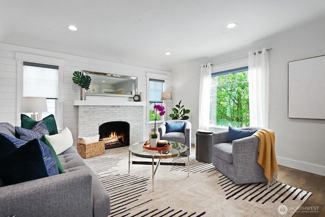 3236 15th Ave S, Seattle, WA 98144 - living room featuring wood finished floors, baseboards, a fireplace, and recessed lighting
