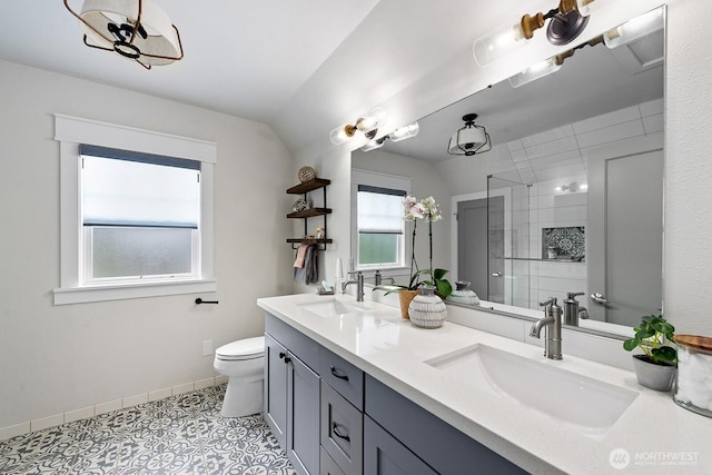 3236 15th Ave S, Seattle, WA 98144 - full bath with a stall shower, toilet, double vanity, tile patterned floors, and baseboards