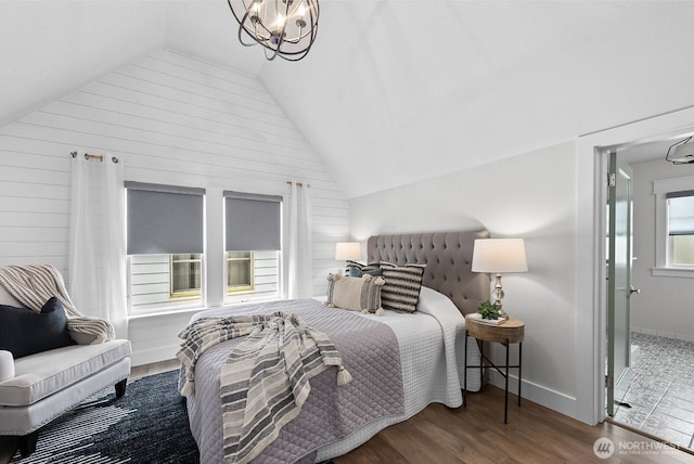 3236 15th Ave S, Seattle, WA 98144 - bedroom with lofted ceiling, wood finished floors, wooden walls, and baseboards