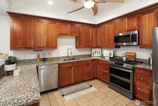 10047 Main St Unit 413, Bellevue, WA 98004 - kitchen with stainless steel appliances, a sink, a ceiling fan, dark stone countertops, and crown molding
