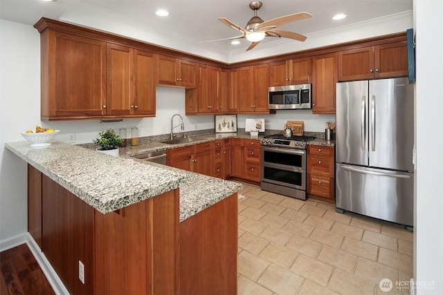 10047 Main St Unit 413, Bellevue, WA 98004 - kitchen with stainless steel appliances, a sink, brown cabinetry, crown molding, and recessed lighting
