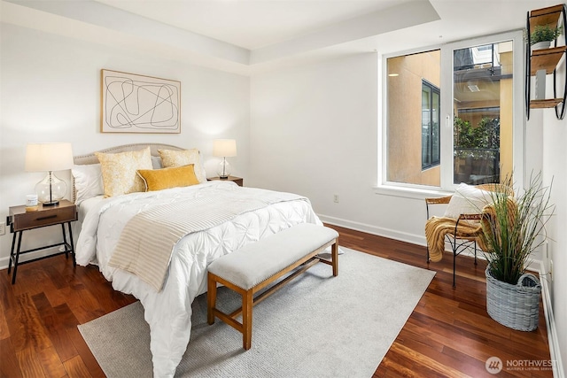 10047 Main St Unit 413, Bellevue, WA 98004 - bedroom with baseboards and wood finished floors