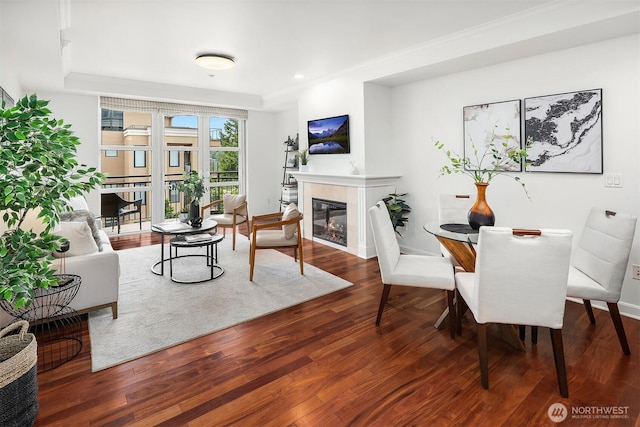 10047 Main St Unit 413, Bellevue, WA 98004 - living area featuring a tile fireplace, wood finished floors, baseboards, and recessed lighting