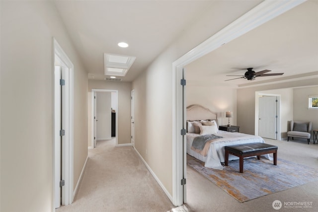bedroom with light colored carpet, baseboards, a ceiling fan, and visible vents