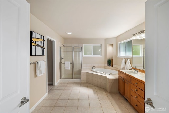 full bath with a shower stall, tile patterned floors, vanity, and a garden tub
