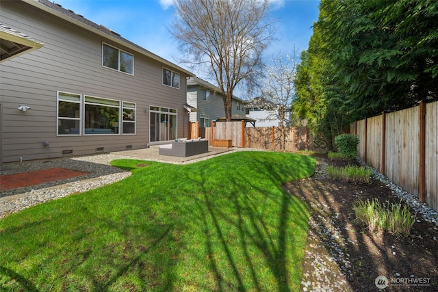 rear view of property with a fenced backyard, outdoor lounge area, a patio, and a lawn
