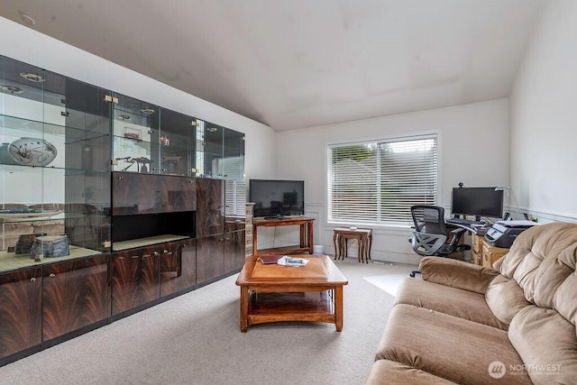 living area with carpet and wainscoting