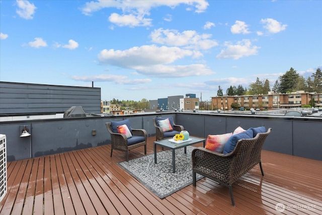 wooden terrace with outdoor lounge area