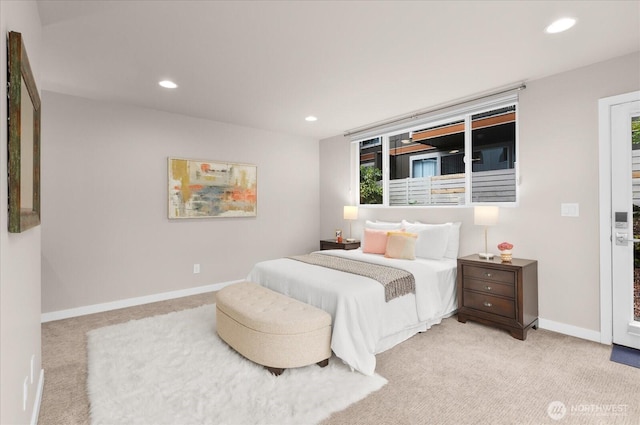 bedroom featuring recessed lighting, light colored carpet, and baseboards