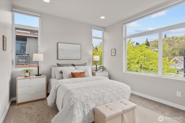 bedroom with baseboards, recessed lighting, and carpet flooring