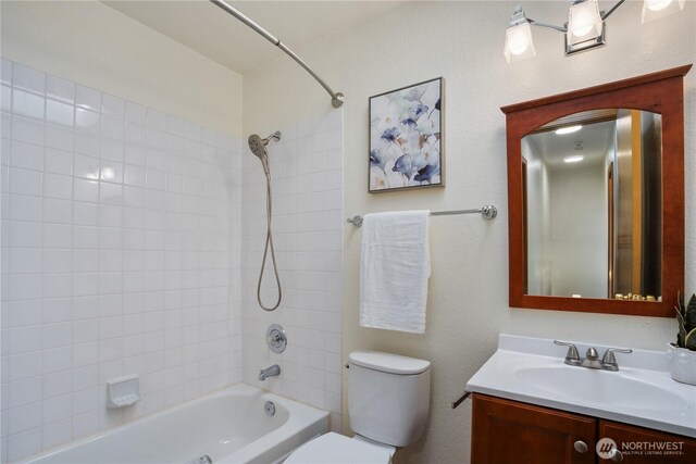 12204 30th St NE, Lake Stevens, WA 98258 - bathroom featuring vanity, washtub / shower combination, and toilet