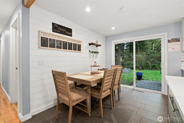 8207 Woodbourne Dr SW, Lakewood, WA 98499 - dining area featuring recessed lighting, wooden walls, and wood finished floors