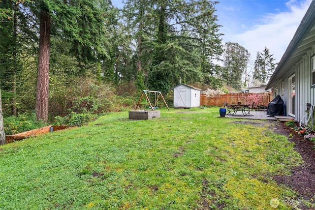 8207 Woodbourne Dr SW, Lakewood, WA 98499 - view of yard with an outbuilding, a shed, and fence