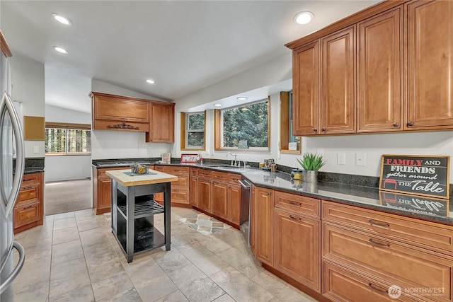 28529 298th Pl SE, Ravensdale, WA 98051 - kitchen featuring brown cabinets, stainless steel dishwasher, recessed lighting, and lofted ceiling