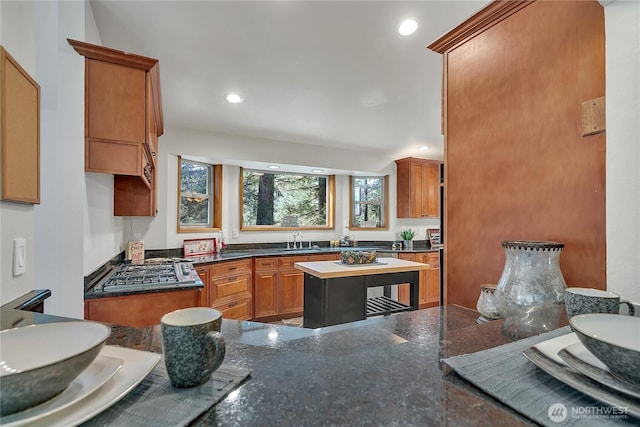 28529 298th Pl SE, Ravensdale, WA 98051 - kitchen featuring brown cabinetry, recessed lighting, a sink, and stainless steel gas stovetop