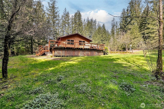28529 298th Pl SE, Ravensdale, WA 98051 - back of house with a yard, a deck, and a view of trees