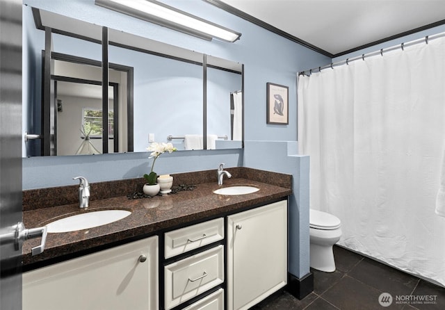 full bathroom featuring crown molding, toilet, a sink, tile patterned floors, and double vanity