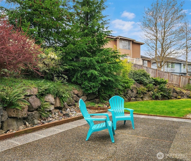 view of patio / terrace featuring fence