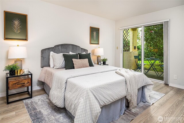 bedroom featuring access to outside, light wood-style floors, and baseboards