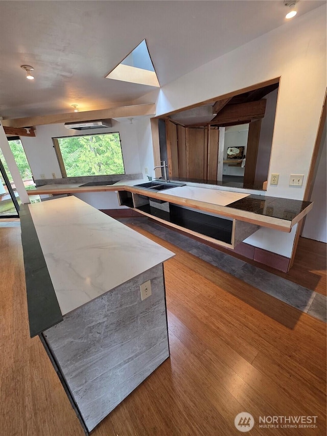 5612 Cape George Rd, Port Townsend, WA 98368 - interior space with wood finished floors, a sink, and stone countertops