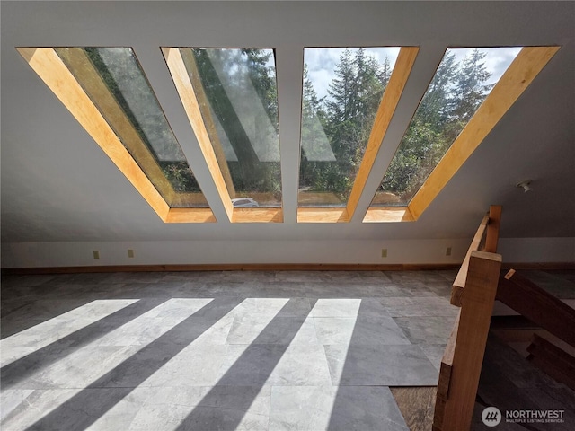 5612 Cape George Rd, Port Townsend, WA 98368 - interior space featuring lofted ceiling with skylight and baseboards