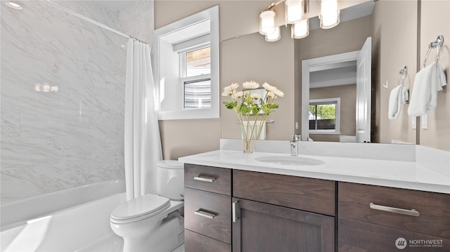 full bathroom featuring shower / bath combination with curtain, toilet, and vanity
