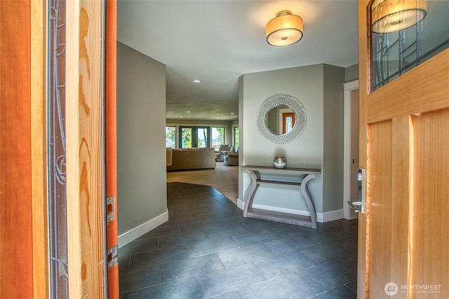 entrance foyer with baseboards and recessed lighting