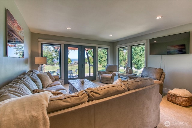 living room with french doors, carpet, and recessed lighting