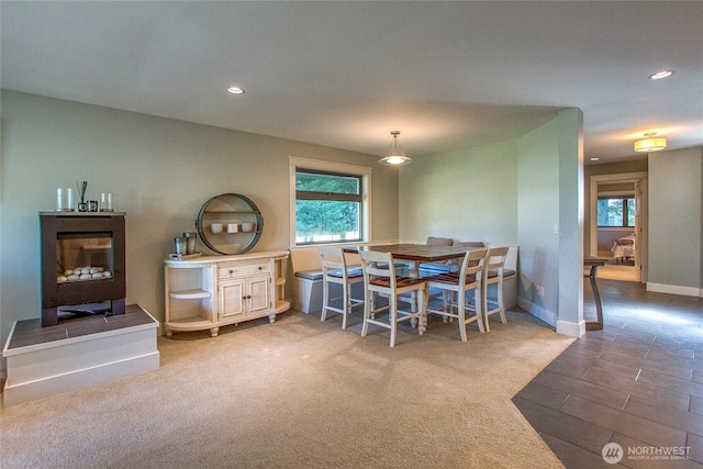 dining area with recessed lighting, plenty of natural light, baseboards, and wood finished floors
