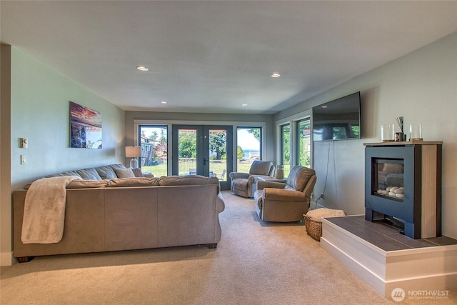 living room with recessed lighting, french doors, and carpet floors