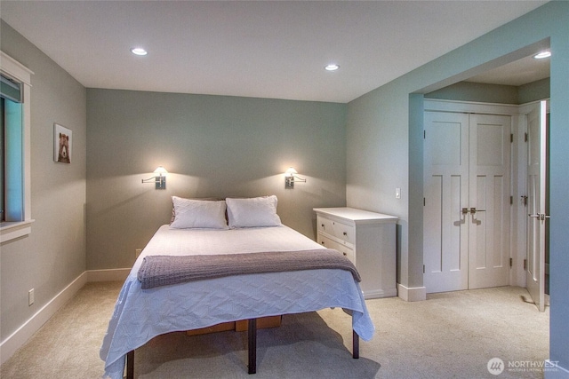 bedroom featuring baseboards, recessed lighting, and light carpet