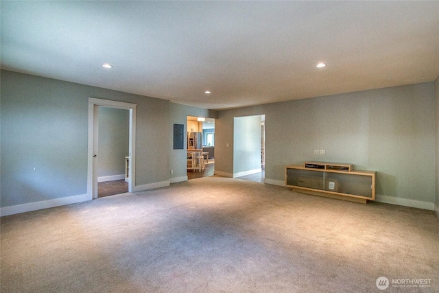 carpeted empty room featuring recessed lighting and baseboards