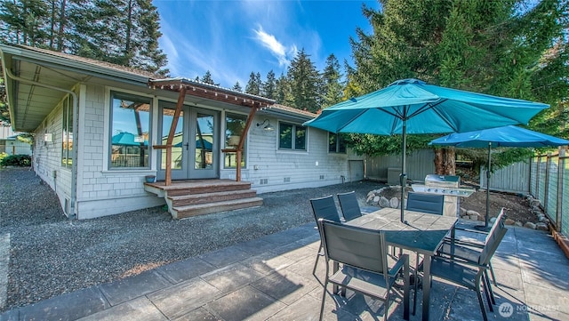 view of patio / terrace featuring outdoor dining space, grilling area, and fence private yard