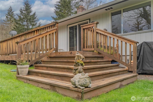 wooden deck featuring stairs